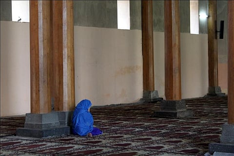 A Kashmiri woman prays inside the historic Jamia Masjid in Srinagar. According to the survey, women in the Valley are more afflicted by mental distress than men Credit: Flickr