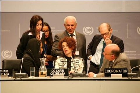 Newly-elected APA co-chairs Sarah Baashan, Saudi Arabia (left), and Jo Tyndall, New Zealand (centre), speak with members of the Secretariat
Credit: IISD Reporting Services