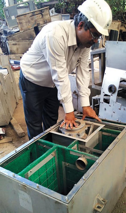 An engineer from
the Indian Railways
inspects a bio-toilet (Photo: Chhavi Sachdev)