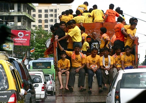 Event organisers prefer young boys and girls because they are light and they can easily climb on top. Credit: Satish Krishnamurthy/Flicker