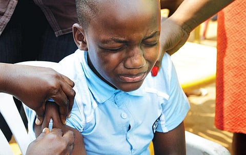 A child being vaccinated during
an emergency campaign
against yellow fever in Congo's
capital Kinshasa (Photo: Reuters)