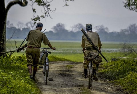 Two forest guards on duty in Manas National Park, which is home to tigers, rhinos, elephants and other threatened and endangered species. Photo by M. Kundal Bora.