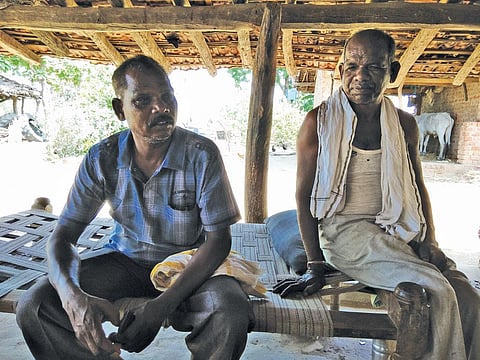 Pandu Singh Marshkole (seated on the right), a Gond tribal of Betul's Dolhara village, says about 200 families in the village want pattas for the land they have lived on for decades. (Photos: Jitendra)