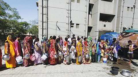 Tankers are the main source of water for many households in Gujarat, like these women collecting their daily quota on the outskirts of Ahmedabad (Photo: Photographs: Amit Dave)