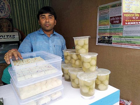 Abhishek Roy at his sweet shop in West Bengal's Singur town with tulsi rosogollas on display. His sales have tripled since the Roy brothers launched the healthy variant (Photo: Dhrubonath Das)