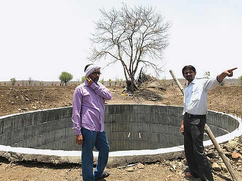 Mahesh Madhukar Besadkar (right) of Maharashtra's Yavatmal district says that his open well has been dry for months and he has not been able to cultivate rabi crop this year (Photographs: Nidhi Jamwal)