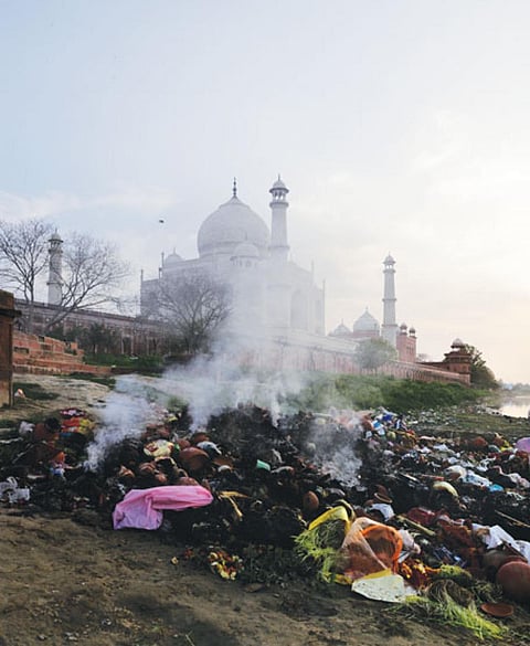 A pile of burning trash near the Taj Mahal in Agra
