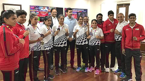Minister for Sports, Rajyavardhan Rathore with some of the sportspersons who were part of the Asian Games contingent Credit: Press Information Bureau