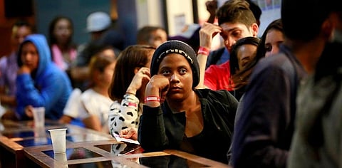 Venezuelan migrants wait at the Binational Border Service Center of Peru. REUTERS/Douglas Juarez