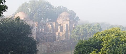 An ancient building in Hauz Khas village enveloped in smog. Credit: Getty Images