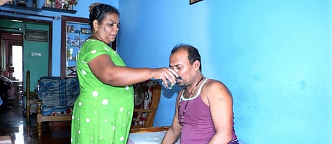 Lorence Bernard, who was rescued after five days of going into the sea, with his wife. Credit: Rejimon Kuttappan