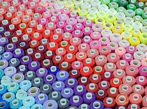 Spools of coloured thread. Credit: Getty Images