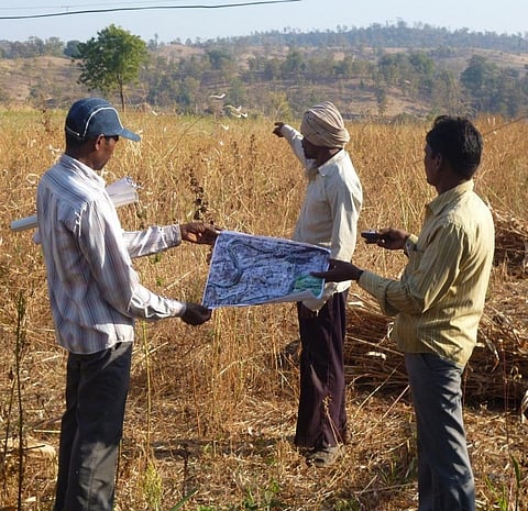 Mapping work done by residents of Narmada district in Gujarat using a GPS device to demarcate their land under Forest Rights Act. Photo for representational purposes. Credit: Anupam Chakravartty