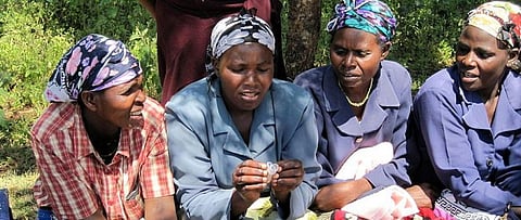 Women in Meru, Kenya, examine menstrual cups. Photo: Wikimedia Commons