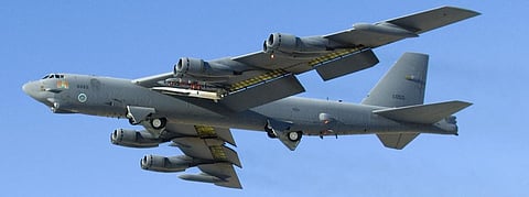 A new-generation weapon, in white, launches from an older one, the B-52 bomber. Mike Cassidy / US Air Force
