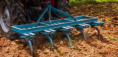 Harrowing land with a tractor. Photo: Getty Images