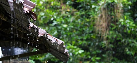 Rainwater dripping down a sloping roof. Photo: Getty Images