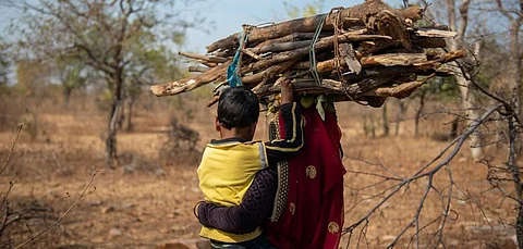 A woman and her child fetching firewood in a Lalitpur village. Photo: World Vision India
