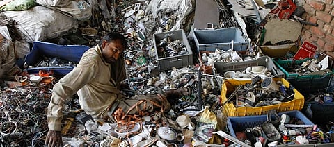 Labourers sort through plastic waste at the Tikri Kalan plastic waste depot in New Delhi. Photo: Vikas Choudhary