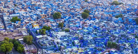 A panoramic view of blue-painted houses in Jodhpur, close to the Thar desert. Using lighter shades to paint houses can reflect heat. Photo: Getty Images