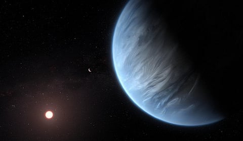 This artist’s impression of the planet K2-18b, its host star and an accompanying planet. Photo: ESA/Hubble, M Kornmesser