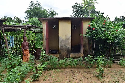 Bibatsa Thela of Sikachhida village, Odisha in front of his toilet constructed in 2006. He says it is much better and spacious than the one made under SBM in 2014. Photo: Priya Ranjan Sahu
