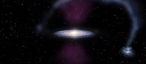 An artist's impression of the massive bursts of ionizing radiation exploding from the center of the Milky Way and impacting the Magellanic Stream. Photo: James Josephides/ASTRO 3D