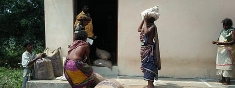 People of a village in Odisha's Rayagada district collect food grains under the PDS Photo: Priya Ranjan Sahu