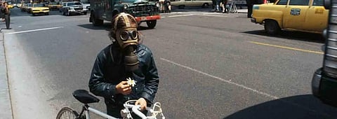 Cyclist near 59th Street in Manhattan on the first Earth Day, April 22, 1970. (Bettmann / Getty Images)