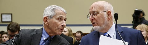 Anthony Fauci, left, director of the National Institute of Allergy and Infectious Diseases, speaks with Robert Redfield, director of the Centers for Disease Control and Prevention Photo: AP/Patrick Semansky