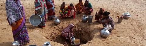 Women in Kansa village in Sukinda block of Odisha’s Jajpur district collect water from a pit Photo: Ashis Senapati