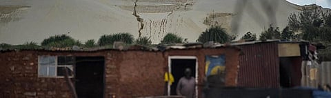 Grootvlei, Snake Park, an impoverished suburb on the fringe of one of the biggest mine dumps in Soweto, Johannesburg. Poor people have been hit hardest by the fallout of COVID-19. Mujahid Safodien/AFP via Getty Images