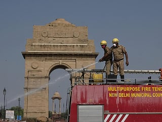 Delhi Fire Service personnel spray disinfectant near India Gate, Delhi during the nationwide lockdown to curb the novel coronavirus disease (COVID-19) Photo: Vikas Choudhary