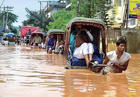 Bharalu river’s ability to carry excess rainwater to the Brahmaputra has reduced because people use it as a dumping ground for garbage (Photographs: Manash Das)