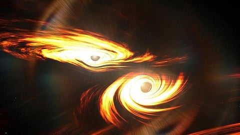An artistic rendering shows a pair of black holes on a collision course, similar to one recently discovered by astronomers. Photo: Mark Myers / ARC Center of Excellence for Gravitational Wave Discovery