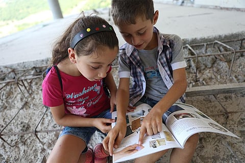 Children reading a book