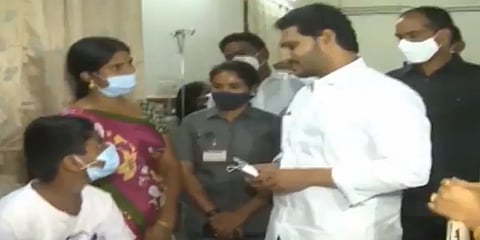 Andhra Pradesh CM YS Jagan Mohan Reddy with patients at a hospital. At least 450 people have been hospitalised since December 5, 2020, with most of them suffering from seizures, nausea, dizziness and headaches. Photo: Twitter