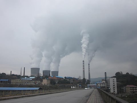 Why does China await its emission trading scheme for thermal power plants