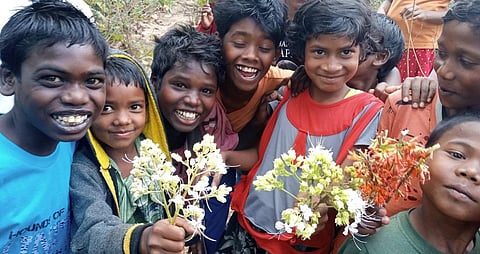 The children of Jana village in Jharkhand, with medicinal plants in their hands. Photo: Author provided