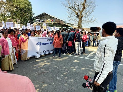 Thousands descended on the National Highway-15 to protest against the state government’s alleged tardiness to control erratic flooding of the Jiadhal river. Photos: Harish Pegu