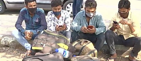 Migrants waiting to leave Mumbai. Photo: ANI / Twitter