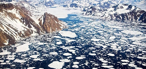 Due to increasing temperatures, Arctic icebergs, like these near Kulusuk Island off the southeastern coast of Greenland, are rapidly melting and could cause flooding that will impact hundreds of millions of people across the globe by 2100. (Photo credit: NASA Goddard Space Flight Center). Photo owned by Independent Media Institute