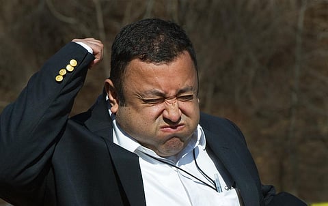 A television reporter reacts to being hit by a heat ray during a demonstration of the U.S. military’s Active Denial System. Paul J. Richards/AFP via Getty Images