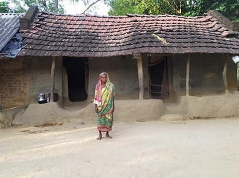 Suba Bhendaria, 54, a widow, lives alone in Salachua revenue village under the Kaptipada Block of Mayurbhanj District, Odisha. Her isolation is the result of a social boycott by villagers who have branded her as a witch. Photo: Debabrat Patra