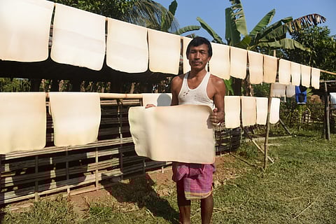Rubber sheets are hanged to dry, in a village on December 15, 2021 in Goalpara, Assam, India. Photo for representation. Source: IStock