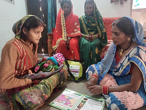 A Mitanin on a visit to a new born’s house.