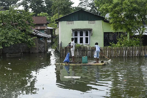 Photo for representation. People in a flooded area in Morigaon district of Assam on July 13, 2020. Photo: iStock