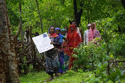 Women of Tumbahra nagar panchayat holding the CFRR. Photo: Purushottam Singh Thakur