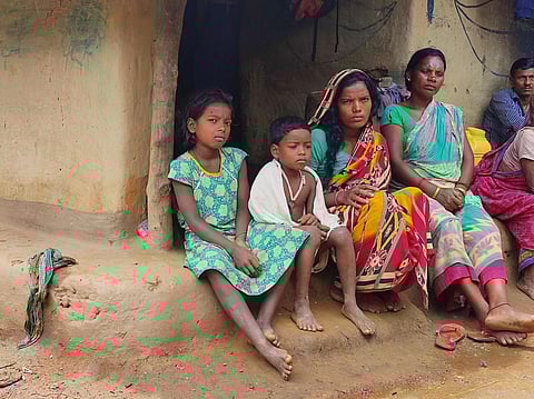 From L-R: Geeta, Sonu and Laxmi Sardar outside their hut in Jhargram. Photo: Mrinalini Paul