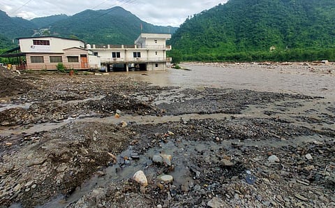 Encroachments on water bodies and slopes are weak links in an early warning system. Photo: Megha Prakash